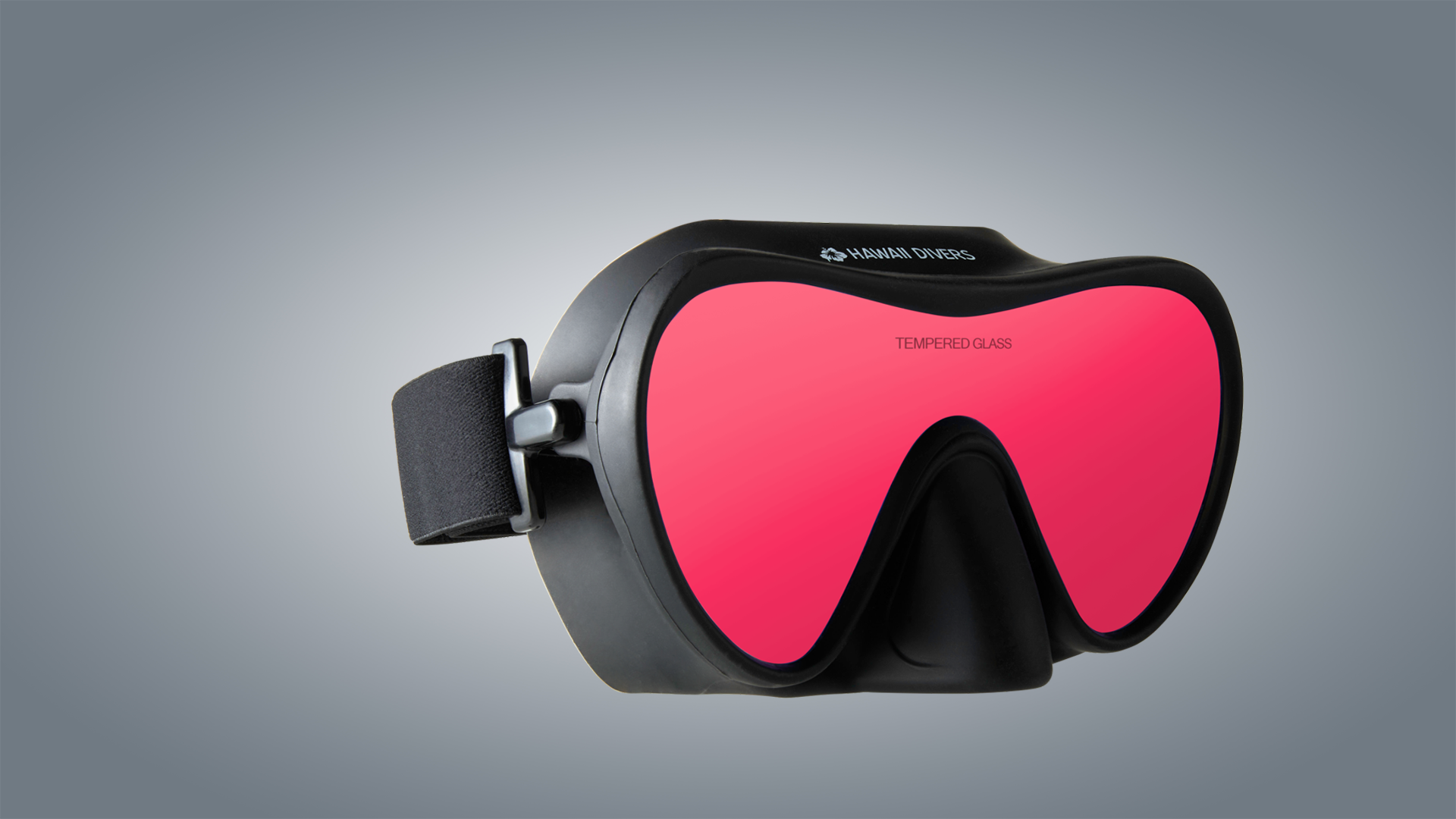 Red goggles with black frame on a gray background